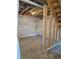 Unfinished basement space with exposed beams and white wrapped walls at 6046 Keyser Pl, Brighton, CO 80601