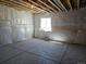Unfinished basement with concrete floor, window, and white wrapped walls at 6046 Keyser Pl, Brighton, CO 80601