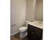 Powder room with a modern vanity, sink, and toilet at 6046 Keyser Pl, Brighton, CO 80601