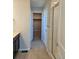 Bathroom with a shower with glass door and a walk-in closet with a sliding door at 6046 Keyser Pl, Brighton, CO 80601