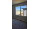 Bedroom with carpet and a large window with pretty exterior views at 6046 Keyser Pl, Brighton, CO 80601