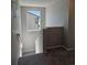 Upstairs hallway with stairs leading down and window with exterior views at 6046 Keyser Pl, Brighton, CO 80601