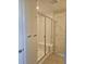 Bathroom shower with glass doors and built in bench, offering a modern and convenient feature at 6046 Keyser Pl, Brighton, CO 80601