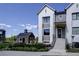 Modern two-story home with a barn in the background, showcasing a bright and open neighborhood at 242 Clementina St, Louisville, CO 80027