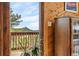 Balcony area with wood railing, and scenic views of the outdoors at 25019 N Mountain Park Dr, Evergreen, CO 80439