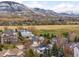 Picturesque aerial view of homes nestled in a scenic community with mountains in the background at 17705 W 63Rd Dr, Golden, CO 80403