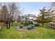 Landscaped backyard featuring a well-maintained lawn and patio area perfect for outdoor entertaining at 17705 W 63Rd Dr, Golden, CO 80403