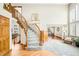 Elegant foyer with hardwood floors, curved staircase, and open layout at 17705 W 63Rd Dr, Golden, CO 80403