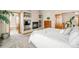 Spacious main bedroom featuring a fireplace, ensuite bathroom, and neutral decor at 17705 W 63Rd Dr, Golden, CO 80403
