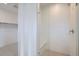 Modern bathroom featuring a glass shower with seating and textured tile at 710 Belay St, Erie, CO 80516