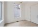 Bright bedroom with hardwood floors, fresh white paint, and a window that allows natural light at 710 Belay St, Erie, CO 80516