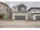 New construction with a two-car garage, modern architecture, and neat landscaping at 710 Belay St, Erie, CO 80516