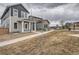 A nicely landscaped yard and sidewalk that leads to this charming two-story home at 710 Belay St, Erie, CO 80516