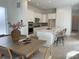 Eat-in kitchen with large island, stainless steel appliances, and modern pendant lighting at 710 Belay St, Erie, CO 80516