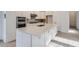 Modern kitchen with sleek countertops, stainless steel appliances, and white cabinetry at 710 Belay St, Erie, CO 80516