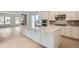 Bright, open layout combines modern kitchen with fireplace and adjacent living area at 710 Belay St, Erie, CO 80516