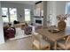 Inviting living room with stylish decor, fireplace, and lots of natural light at 710 Belay St, Erie, CO 80516