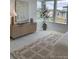 Bright bedroom featuring area rug, modern furnishings, and neighborhood views at 710 Belay St, Erie, CO 80516