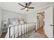 Comfortable bedroom with a wrought iron bed, hardwood flooring, and a door leading to the closet at 2830 Forest St, Denver, CO 80207