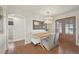 Inviting dining area featuring a built-in bench, stylish light fixture, wood floors, and glass doors at 2830 Forest St, Denver, CO 80207