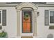 Welcoming front door framed by brick accents and adorned with a wreath, enhancing curb appeal at 2830 Forest St, Denver, CO 80207