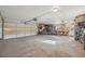 Large garage with ample storage space, work area, and overhead door; ideal for hobbyists and projects at 2830 Forest St, Denver, CO 80207