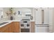 Modern kitchen featuring updated appliances, white countertops, and a clear view into the living room at 2830 Forest St, Denver, CO 80207