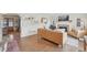 Bright living room with hardwood floors, fireplace, archway, and comfortable leather seating at 2830 Forest St, Denver, CO 80207