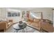 Bright living room with hardwood floors, comfortable seating, and a charming entryway at 2830 Forest St, Denver, CO 80207
