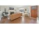 Bright living room with hardwood floors, fireplace, archway, and comfortable leather seating at 2830 Forest St, Denver, CO 80207