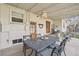 Covered patio with stylish outdoor furniture, perfect for entertaining or relaxing with a serene ambiance at 2830 Forest St, Denver, CO 80207