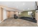 Finished basement with workout space, comfortable seating area and neutral decor at 2072 Skylark Ct, Longmont, CO 80503
