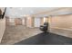 Spacious finished basement featuring neutral carpeting, recessed lighting, and ample storage cabinets at 2072 Skylark Ct, Longmont, CO 80503