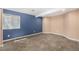 Basement bedroom featuring neutral carpet, a window, and freshly painted walls at 2072 Skylark Ct, Longmont, CO 80503