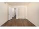 Simple bedroom with double closet and dark wood floors is perfect for relaxation at 2072 Skylark Ct, Longmont, CO 80503