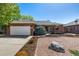 Charming single story brick home with a well-manicured yard and driveway at 2072 Skylark Ct, Longmont, CO 80503