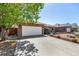 View of the exterior featuring the garage, driveway and landscaping at 2072 Skylark Ct, Longmont, CO 80503