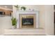 Close-up of a modern fireplace with tile surround and wooden mantel at 2072 Skylark Ct, Longmont, CO 80503