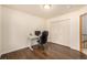 A well-lit home office features hardwood floors and a spacious closet at 2072 Skylark Ct, Longmont, CO 80503