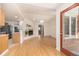 Open-concept living room and kitchen area with a fireplace and hardwood flooring at 2072 Skylark Ct, Longmont, CO 80503