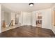 Open-concept living room with hardwood floors seamlessly flowing to the kitchen at 2072 Skylark Ct, Longmont, CO 80503