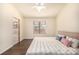 Bedroom with hardwood floors, ceiling fan, and a large window at 2072 Skylark Ct, Longmont, CO 80503