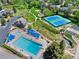 Aerial view of the community pool, tennis courts, and playground at 7659 S Rosemary Cir, Englewood, CO 80112