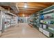 Spacious basement with shelving, offering ample storage space for various needs at 7659 S Rosemary Cir, Englewood, CO 80112