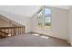 Bonus room with carpeted floors and tall windows providing ample natural light at 7659 S Rosemary Cir, Englewood, CO 80112