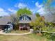 Charming brick home with mature landscaping and blue siding accents at 7659 S Rosemary Cir, Englewood, CO 80112