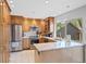 Modern kitchen with stainless steel appliances, granite countertops, and ample storage space at 7659 S Rosemary Cir, Englewood, CO 80112