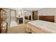 Spacious main bedroom with ensuite bathroom and mirrored closet doors at 7659 S Rosemary Cir, Englewood, CO 80112