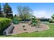 Neighborhood playground features multiple play structures with a cushioned surface at 7659 S Rosemary Cir, Englewood, CO 80112