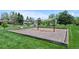A swing set in a neighborhood playground with a cushioned surface at 7659 S Rosemary Cir, Englewood, CO 80112
